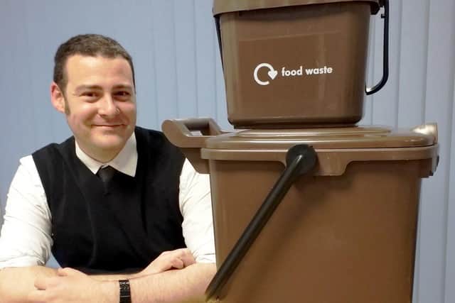 Cllr Dave Ashmore from Portsmouth City Council with food waste caddies