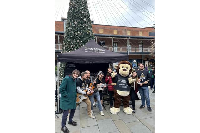The George's Rockstars team performing their Christmas 2023 single Let's Make Christmas Loud! at Gunwharf Quays, Portsmouth
