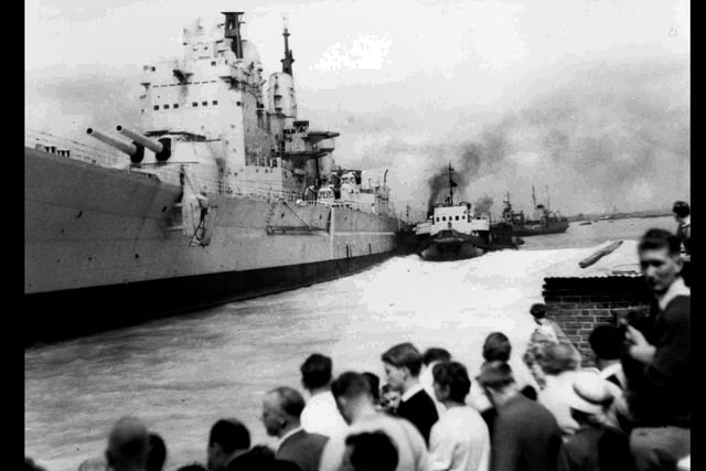 A different view of HMS Vanguard when she came adrift when being towed out of the harbour and ran into Point, Old Portsmouth. Leaving the harbour at 10.00 on 4 August 1960 and at 10.35 she ran aground into 24ft of water.  She was aground for 40 minutes before being towed out into the mainstream and on her way to the breakers yard at Faslane.