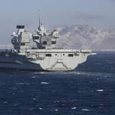 HMS Prince of Wales pictured sailing past the 'Rock' of Gibraltar