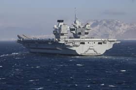 HMS Prince of Wales pictured sailing past the 'Rock' of Gibraltar