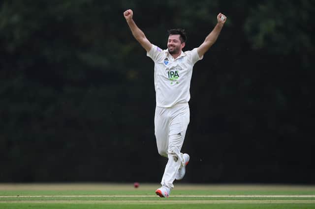Ian Holland celebrates after dismissing Gus Atkinson of Surrey to claim his sixth wicket during the second day of the Bob Willis Trophy match between Hampshire and Surrey at Arunde. Photo by Mike Hewitt/Getty Images.