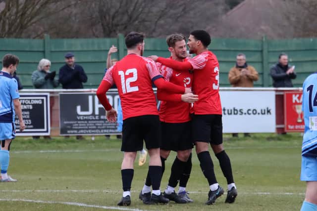 Tom Settle, middle, has just made it 2-2 from the penalty spot. Picture by Ken Walker.