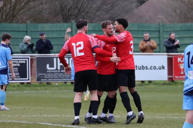 Tom Settle, middle, has just made it 2-2 from the penalty spot. Picture by Ken Walker.