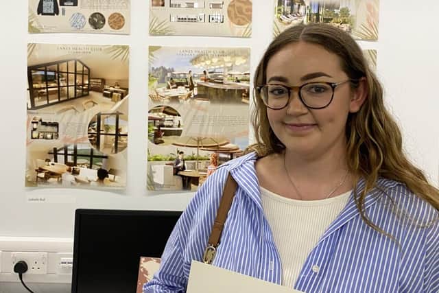 Isabelle Bull with her certificate for winning the Linden Homes Award