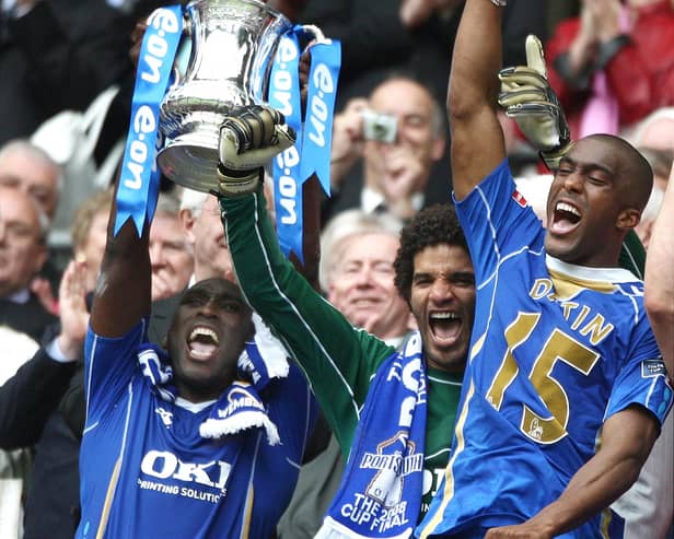 David James, centre, with Sol Campbell and Sylvain Distin winning the FA Cup. The former England keeper has big hopes for Pompey this season,