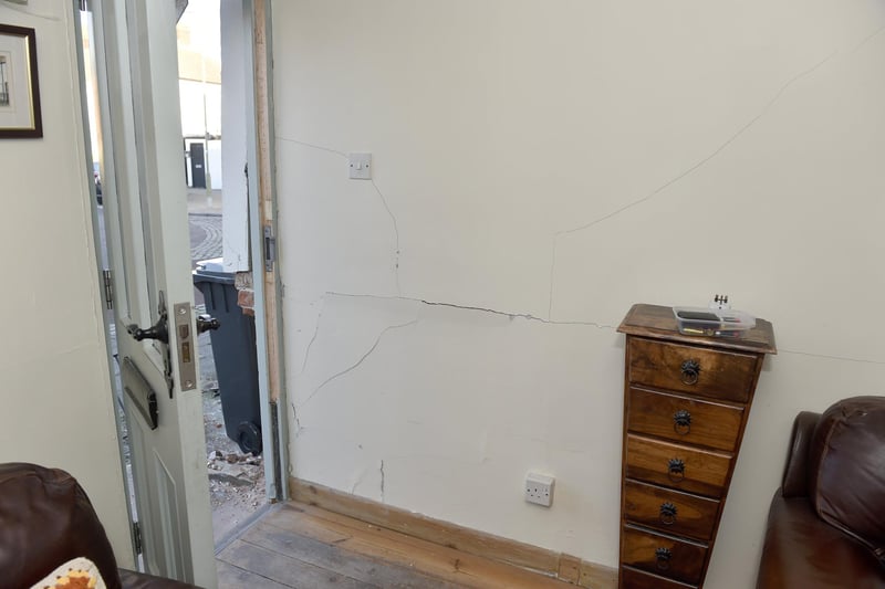 Damage to Voluptuous Vintage shop and a residential property next door in Village Road, Alverstoke, where a two-car collision took place and three people have been arrested.

Pictured is: Damage to the house in Village House, Alverstoke.

Picture: Sarah Standing
