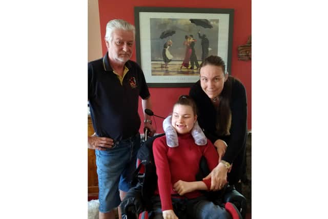 Eleanor Raleigh, 15, with dad Chris, 61, and mum Yvonne, 47, at their home in Fareham