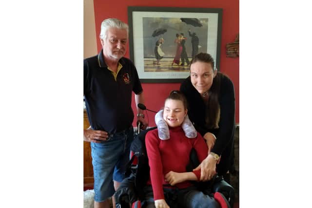 Eleanor Raleigh, 15, with dad Chris, 61, and mum Yvonne, 47, at their home in Fareham