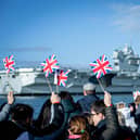 Pictured: Families gathering at Portsmouth Naval Base to see HMS Prince of Wales return home after a three month deployment in the USA. The Queen Elizabeth-class carrier completed her first long-term mission after being beset with mechanical problems last year.