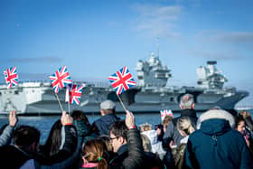 Pictured: Families gathering at Portsmouth Naval Base to see HMS Prince of Wales return home after a three month deployment in the USA. The Queen Elizabeth-class carrier completed her first long-term mission after being beset with mechanical problems last year.