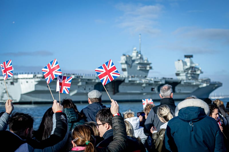 Pictured: Families gathering at Portsmouth Naval Base to see HMS Prince of Wales return home after a three month deployment in the USA. The Queen Elizabeth-class carrier completed her first long-term mission after being beset with mechanical problems last year.