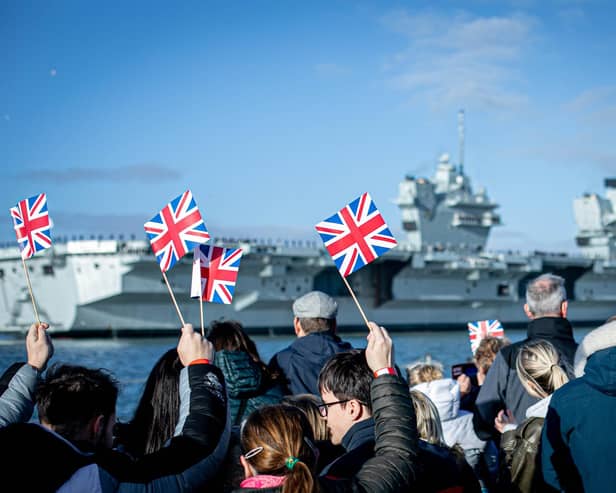 Pictured: Families gathering at Portsmouth Naval Base to see HMS Prince of Wales return home after a three month deployment in the USA. The Queen Elizabeth-class carrier completed her first long-term mission after being beset with mechanical problems last year.