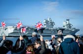 Pictured: Families gathering at Portsmouth Naval Base to see HMS Prince of Wales return home after a three month deployment in the USA. The Queen Elizabeth-class carrier completed her first long-term mission after being beset with mechanical problems last year.