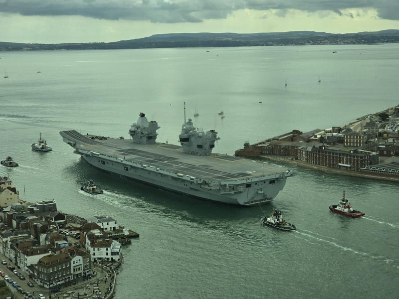 Drone picture of aircraft carrier HMS Prince of Wales leaving Portsmouth on routine tasking.