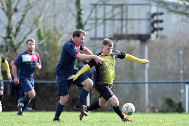 Jamie White (yellow/black) scored Infinity's winner against Bush Hill. Picture: Chris Moorhouse