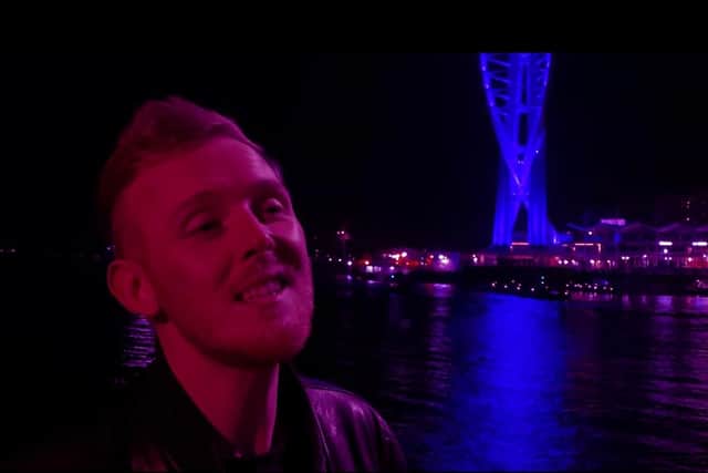 Aled Price, pictured in the music video for "You and I" with the Spinnaker Tower in the background.