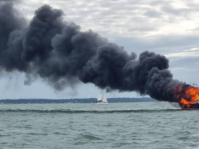 Two people were rescued off a burning boat in Portsmouth harbour on June 19. Pic GAFIRS