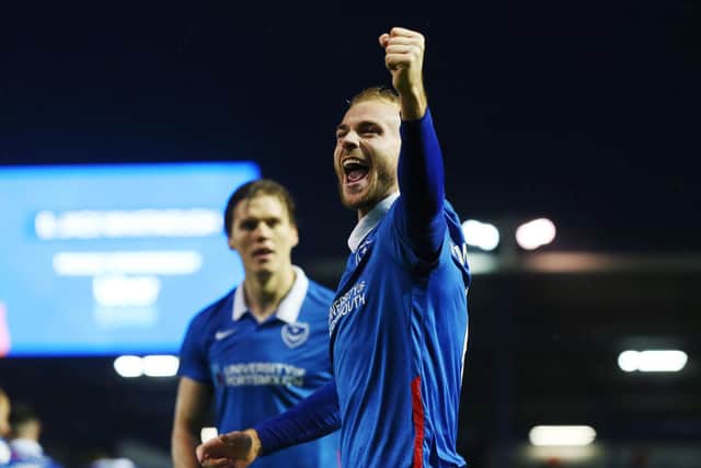 Jack Whatmough celebrates scoring Pompey's opener against Peterborough