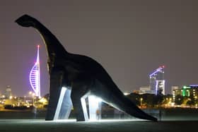 A night shot of Ultrasaurus on Southsea Common with the Portsmouth skyline beyond. Picture: Jon Eastham