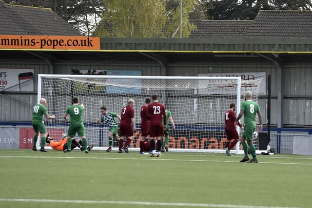 Barry Keogh (middle) has just levelled for Mob Albion against Burrfields. Picture: Allan Hutchings