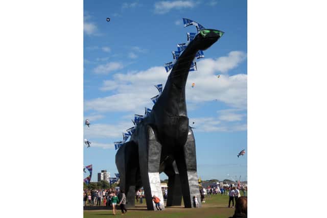 Southsea dinosaur Luna Park watching over the kites on Southsea Common. Photo by Bob Franklin
