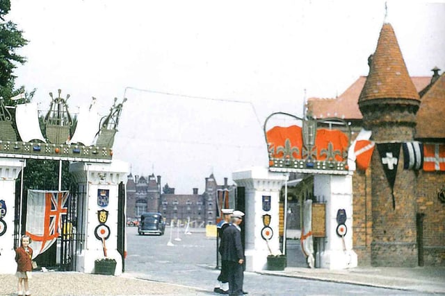 This is the gateway to the Victoria barracks when decorated for the coronation of Queen Elizabeth II in 1953. We see Celia Clark as a young brownie in the image on the left.