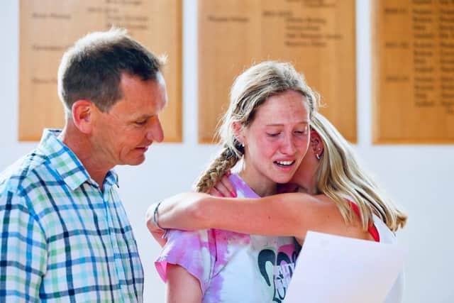 Maddy Oliver is going to Oxford, pictured with her father, Graeme, and sister, Beatrice, at Portsmouth High School. Picture: Chris Moorhouse