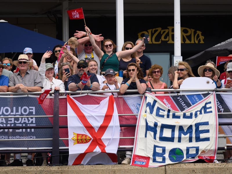 Family and friends greet the finishers at Gunwharf.Picture: Keith Woodland (270721-15)