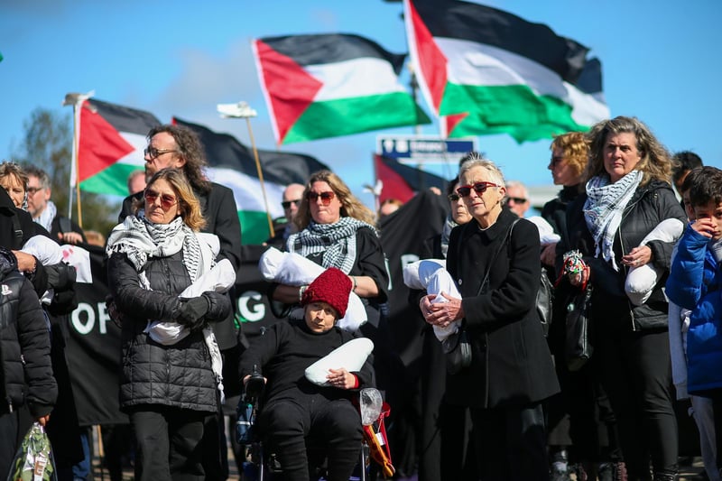 Women hold packages symbolising dead children.Picture: Chris Moorhouse (jpns 170324-23)