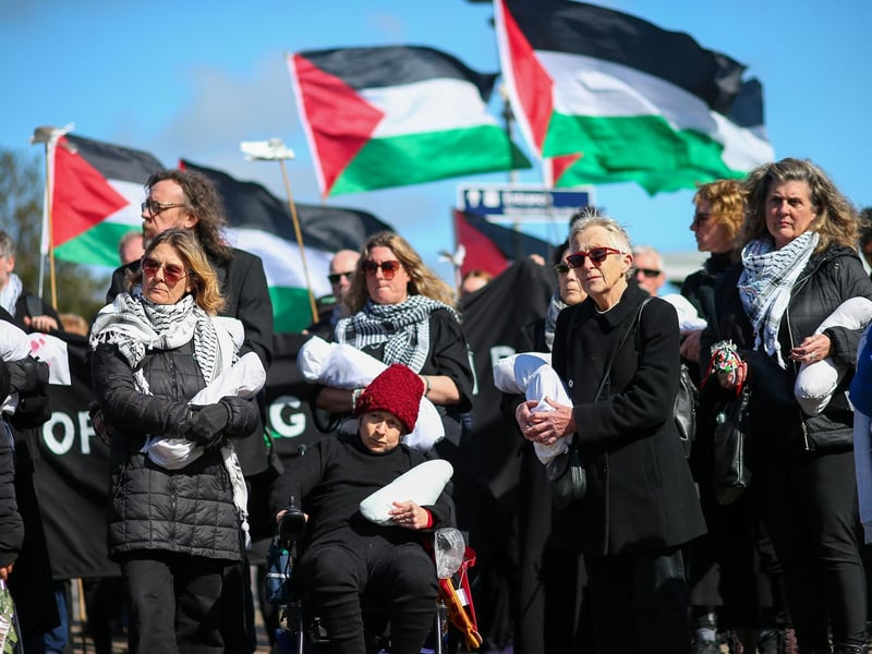 Women hold packages symbolising dead children.Picture: Chris Moorhouse (jpns 170324-23)