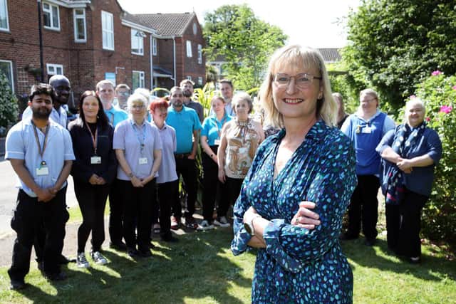 Thorngate CEO stands with some of the charity's 89-strong workforce