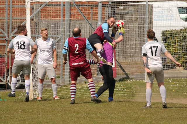 The Watersedge keeper comes under pressure during his side's Division 3 double header with Cross Keys Athletic Reserves. Picture: Kevin Shipp