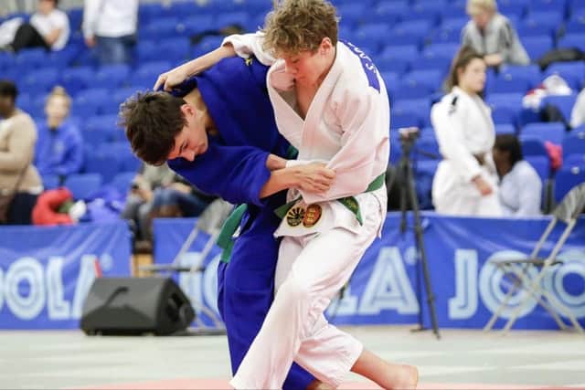 Sam Cooper, right, during his successful junior judo career