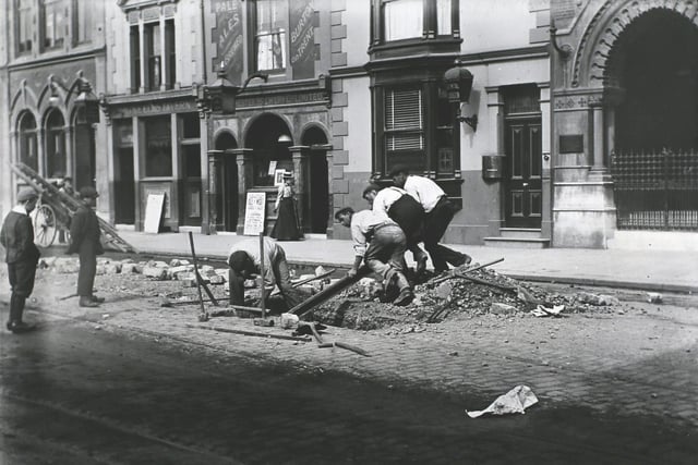 Workers removing old horse car rails from Commercial Road, just south of the Town Hall (now Guildhall) Square, in preparation for the electrification of trams in Portsmouth. This would be some time between 23rd February 1901, when work was started on this section, and the end of May, when work was completed. (Letter from LTA BERN, July 1966). (Photo by Hulton Archive/Getty Images)