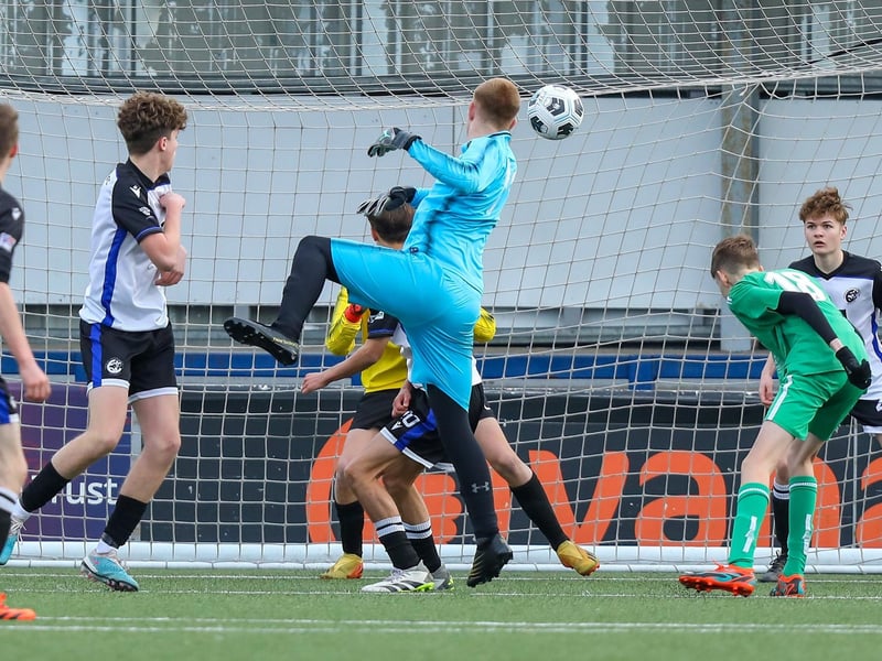 The Cowplain Youth keeper goes up for a last gasp corner, only to see his effort cleared off the line. Picture: Chris Moorhouse