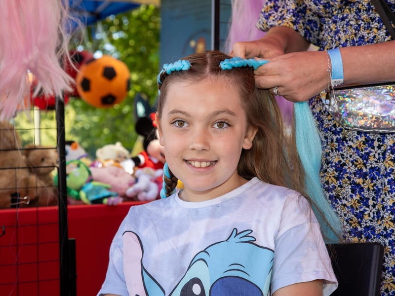 Pictured - Amy Parton, 8 having her hair braided. Photos by Alex Shute
