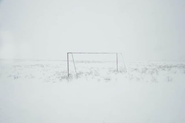 A snowy football pitch
