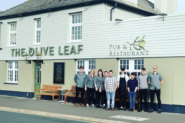 Staff outside The Olive Leaf.