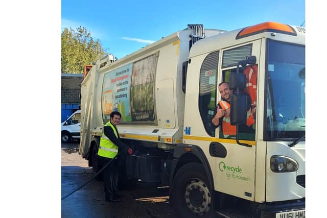 Cllr Dave Ashmore, cabinet member for community safety & environment, filling up a Biffa bin lorry with HVO fuel with Biffa supervisor Michael Hobbs in the driver seat.