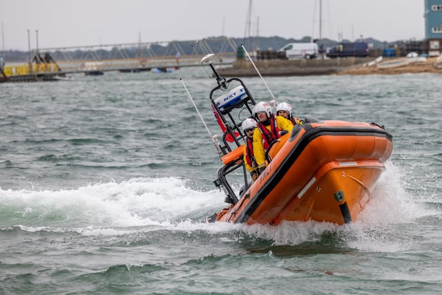 RNLI crews demonstrate their craft's manoeuvrability during the open day at Langstone Harbour. Picture: Mike Cooter (310824)
