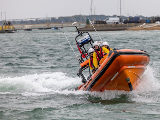 RNLI crews demonstrate their craft's manoeuvrability during the open day at Langstone Harbour. Picture: Mike Cooter (310824)