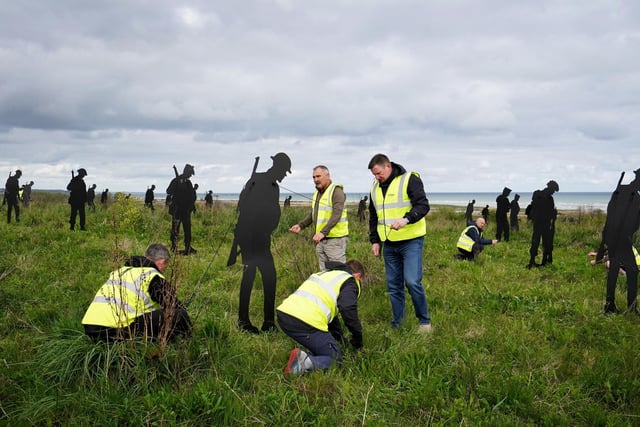 The last of the Standing with Giants silhouettes are put in place at the For Your Tomorrow installation at the British Normandy Memorial, in Ver-Sur-Mer, France, as part of the  80th anniversary of D-Day.