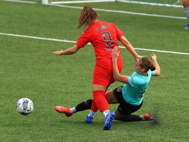 Izzyu Collins makes a sliding tackle. Picture by Dave Haines