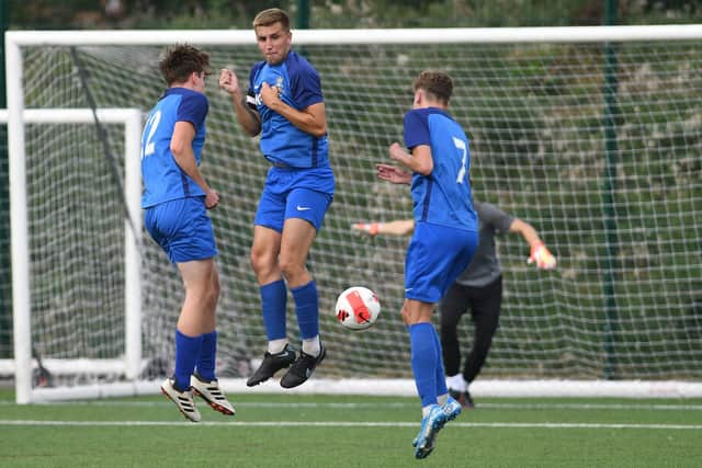 The Baffins Milton U23s wall defend a Burrfields free-kick. Picture: Neil Marshall