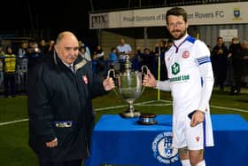 Gosport Borough captain for the night Dan Wooden, right, picks up the Portsmouth Senior Cup trophy Picture: Neil Marshall