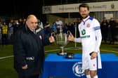 Gosport Borough captain for the night Dan Wooden, right, picks up the Portsmouth Senior Cup trophy Picture: Neil Marshall