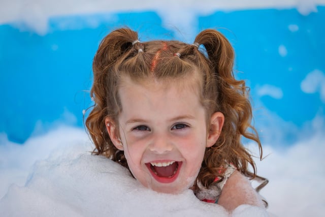 Pictured - Harlia Davison, 4, enjoying the foam pit. Photos by Alex Shute.