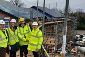 From left, Tim Forer, RNBT trustee, with Olympic gold medallist Eilidh McIntyre, Ray Cornwell, LNT site manager, and Commander Rob Bosshardt, chief executive of the RNBT,  outside the charity's new care home for naval veterans, which is almost completed.