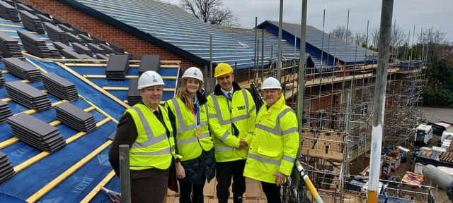 From left, Tim Forer, RNBT trustee, with Olympic gold medallist Eilidh McIntyre, Ray Cornwell, LNT site manager, and Commander Rob Bosshardt, chief executive of the RNBT,  outside the charity's new care home for naval veterans, which is almost completed.